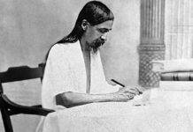 Sri Aurobindo (born Aurobindo Ghose) engrossed in writing. (Source: Wikimedia Commons)