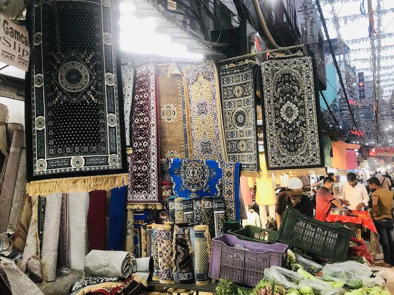 Prayer mats in a wide variety of beautiful designs and weaves on display 